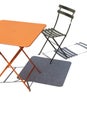 Metal patio chair and orange table Royalty Free Stock Photo