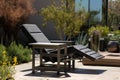 metal patio furnished with a modern outdoor recliner