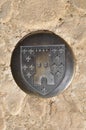 Metal pavement with the coat of arms of the castle of Montfort in the Dordogne