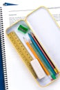 Metal pencil case and book Royalty Free Stock Photo