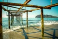 Metal pier on the beach and beautiful view to ancient fortress o Royalty Free Stock Photo