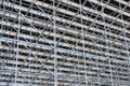 Metal pipe frame structure. Industrial construction from tubes raises upwards. Building process and joining elements view.