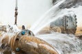 Metal pipe with valve is leaking in water treatment plant Royalty Free Stock Photo