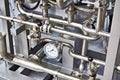 Metal pipes and pressure gauge industrial Royalty Free Stock Photo