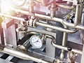 Metal pipes and pressure gauge industrial Royalty Free Stock Photo