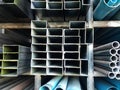 Metal pipes and pvc pipes stack on shelf Royalty Free Stock Photo