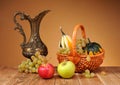 Metal pitcher and fruit Royalty Free Stock Photo