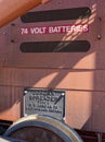 The metal plaque and battery compartment of an historic Jordan Type A Spreader at the rail yard in Oakridge, Oregon, USA