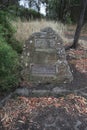 Metal plaque on a stone cairn commemorating William Buckley, an escaped prisoner who lived with the Aboriginals in Buckleys Falls