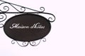 Metal plaque with text in French `Maison d`HÃÂ´tes` guest house Royalty Free Stock Photo