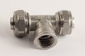 Metal-plastic 20 mm T fitting pipe compression collet connector with 1/2` inside thread Royalty Free Stock Photo