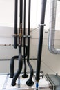 Metal and plastic pipe system on the cellar ceiling of an apartment building