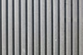 Metal plate fence, sun shining from side. Abstract construction background Royalty Free Stock Photo
