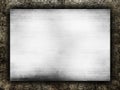 Metal plate on grunge background Royalty Free Stock Photo