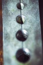 Metal plate with nuts, macro texture background