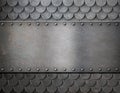 Metal plate over scales armor background Royalty Free Stock Photo