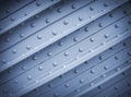 Metal plate with rivets, textural background Royalty Free Stock Photo