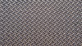 A metal plate with a seamless repeating pattern. Abstract metallic background Royalty Free Stock Photo