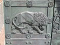 Metal plating depicting lion on door to Ribe cathedral, Denmark Royalty Free Stock Photo