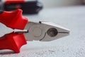 Metal pliers head closeup on blurred background. hand tool close up. copy space Royalty Free Stock Photo