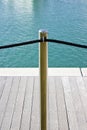 Metal pole with black rope isolated on blue backgrpund