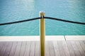 Metal pole with black rope isolated on blue backgrpund