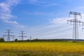 Metal poles electric supports for high-voltage wires in the fields Royalty Free Stock Photo