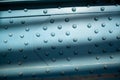 Metal poles pedestrian covered bridge with lots of rivets. Royalty Free Stock Photo