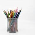 Metal pot containing colouring pencils Royalty Free Stock Photo
