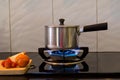 Metal pot on the flame gas stove for boiling water Soup, Royalty Free Stock Photo