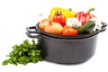 Metal pots and pans with vegetables. Royalty Free Stock Photo