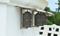 Metal prayer wheels at a white stupa in Hungary.