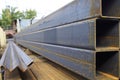 Metal profile pipe of rectangular cross section in packs at the warehouse of metal products