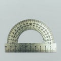 Metal protractor close-up on grey background Royalty Free Stock Photo