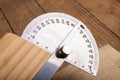 Metal protractor for measuring in carpentry. Minor work in a home workshop