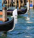 metal prows of traditional Venetian boats called GONDOLAS for the transport of tourists