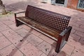 A metal public seat with a square grid pattern in a public plaza in Estepona in Spain Royalty Free Stock Photo