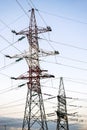 Metal pylons of high-voltage power lines against the evening sky Royalty Free Stock Photo