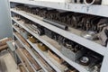 Metal rack with drills blanks in lathe shop. Industrial background. Turnery.