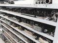 Metal rack with drills blanks in lathe shop. Industrial background. Turnery.