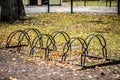 Metal racks for parking bicycles in autumn park