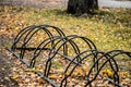 Metal racks for parking bicycles in autumn park