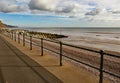 Metal railings on Sidmouth Esplanade, to stop people falling on to the pebble beach some 3 metres below Royalty Free Stock Photo