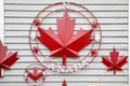 metal red Canadian maple leaf on white background