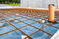 Metal reinforcement grid and wood frame for reinforced concrete basement construction Royalty Free Stock Photo