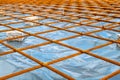 Metal reinforcement grid and wood frame for reinforced concrete basement construction Royalty Free Stock Photo