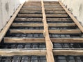 Metal reinforcement and wooden formworks of concrete stairway under construction