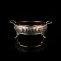 Metal retro sugar bowl on black background Royalty Free Stock Photo