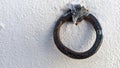 The metal ring is fixed in the wall painted white Royalty Free Stock Photo