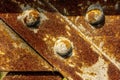 Metal rivets on an old and rusted metallic bridge